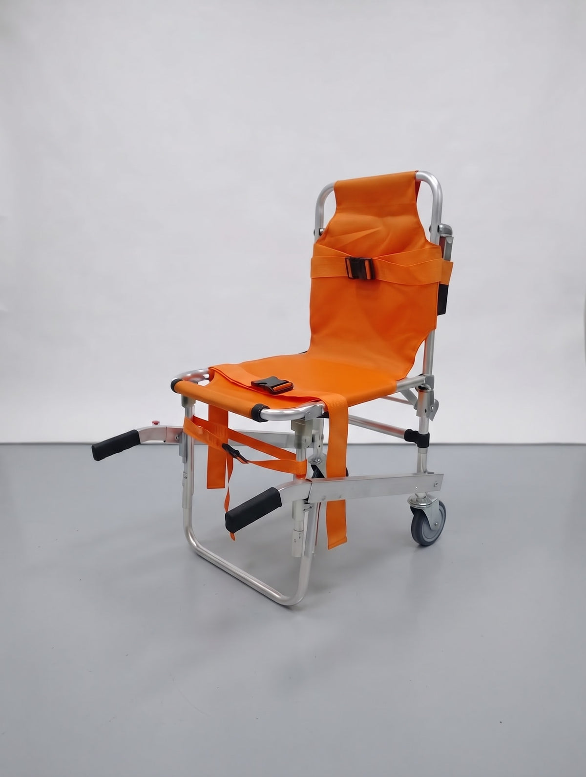 Heavy-duty orange aluminum folding stair stretcher chair with safety harness and carry handles